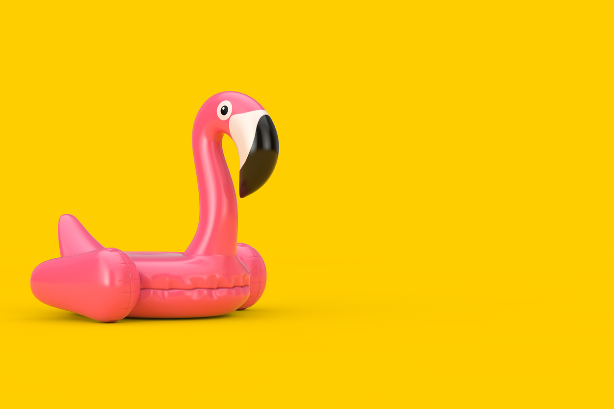 A pink inflatable flamingo pool float is seen on a yellow background. 9 Ways Ontarians Can Keep Online Gambling Fun. 