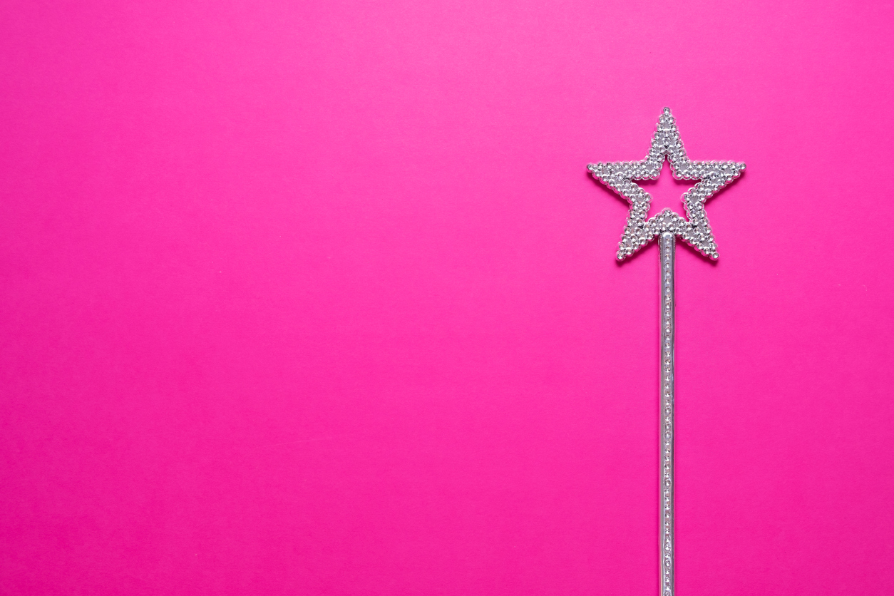 a sparkly silver plasti star-shaped wand sits on a hot pink background. Is A Standardized Responsible Gaming Tool Kit A Good Idea?